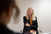 Smiling businesswoman looking away