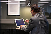 Businessman using laptop in office