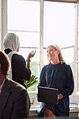 Women talking during business meeting