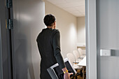 Businesswoman entering boardroom