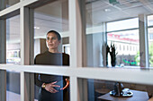 Woman contemplating in office