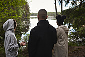 Friends looking at lake