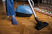 Woman vacuuming living room