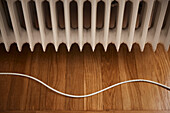 Radiator and cable on floor