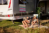 Girls relaxing on sun loungers