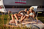 Girls relaxing on sun loungers