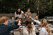 Friends having meal in garden