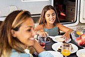 Girl having meal at camping