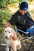 Man sitting with dog