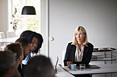 Smiling businesswoman at meeting