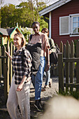 Female friends at wooden fence