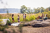 Mother with children relaxing at summer