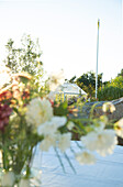 Greenhouse seen from behind bouquet of flowers