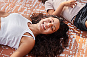 Girl lying down on blanket