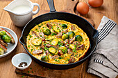 Brussels sprouts omelette with sausages