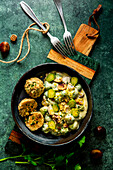 Brussels sprout and macaroni in a cream sauce with bread dumplings and lemon