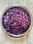 Finely sliced red cabbage in a bowl