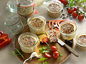 Small olive meatloaves in preserving in jars