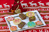 Assorted sugar cookies with colorful sprinkles and chocolate pistachio cookies