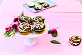 Marble donuts with cream filling on a pedestal dish