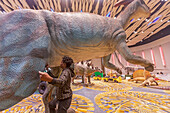 Workers assembling dinosaurs for Detroit Auto Show, USA
