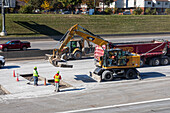 Workers repairing a highway