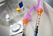 Syringes filled with medication, conceptual image