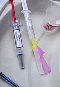 Syringe filled with heparin, concept image