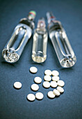 Tablets and vials, conceptual image