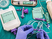 Nurse placing adapter in equipment probe of enteral nutrition