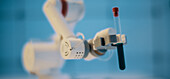 Robotic arm holding test tube
