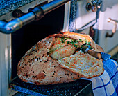 Chicken baked in bread dough