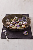 Mini glazed donuts with violets