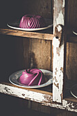 Blueberry Panna Cotta on plates in old wooden shelf