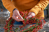 Heart of rose hips on a bent wire wreath blank