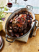 Roast leg of lamb stuffed with olives and rosemary