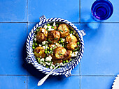 Smashed new potatoes with feta, mint and peas
