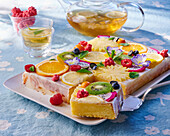 Lemon cake with assorted fruit slices