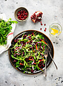 Beetroot salad with rocket, roasted carrots and pomegranate seeds