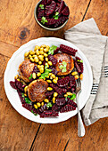 Marinated beetroot with fish cakes and edamame