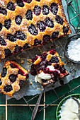 Blackberry coconut cake with blackberry coulis and yogurt