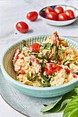 Scrambled eggs with feta cheese and tomatoes