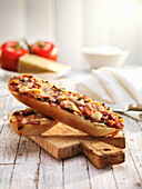 Pizza baguette on a cutting board