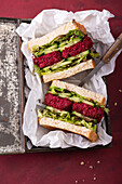 Vegan sandwiches with cucumber, lettuce and beetroot fritters