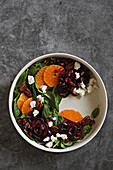 Mandarin Beet Pomegranate Spinach Salad with Feta cheese and caramelized Pecans