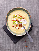 Vegan parsnip and leek cream soup with bacon substitute