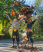Children throwing leaves
