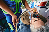 Paramedics treating patient in ambulance