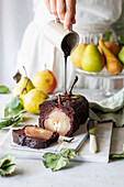 Chocolate cake with poached pears and chocolate icing