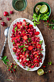 Wild strawberry salad with raspberries and lime